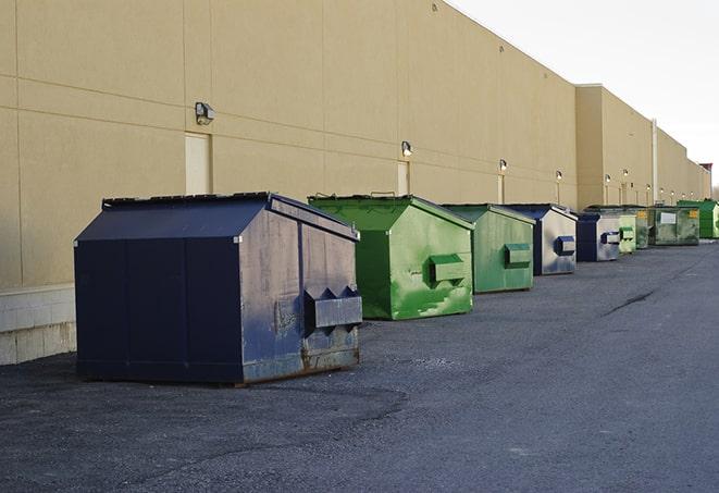 portable, green construction dumpsters serving as a container for scrap materials in Albany